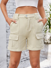 Cream utility pocket high-waist denim cargo shorts with button fly and flap pockets.