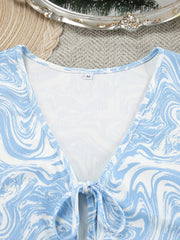 Blue and white marble print loungewear set with tie-front detail and V-neck.