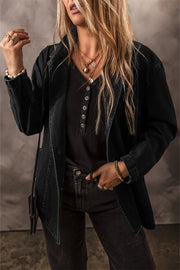 Dark denim double-breasted blazer with notched lapels and button front, worn open.