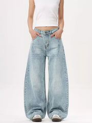 Men's light blue wide-leg stretch jeans with a relaxed fit.