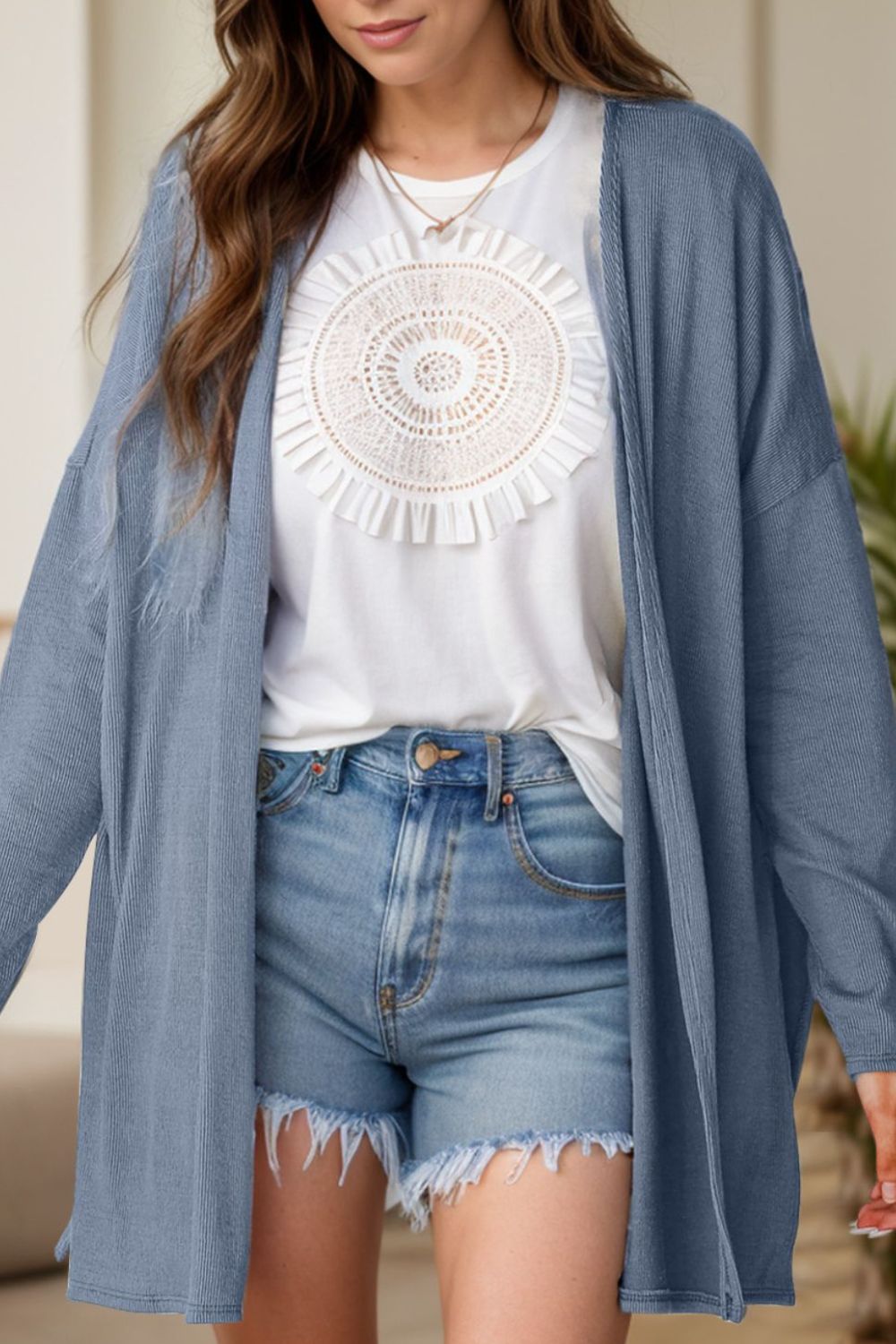 Dusty blue ribbed knit cardigan with side slits, open front, and long sleeves.