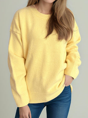Yellow oversized crewneck knit pullover sweater with ribbed cuffs and hem
