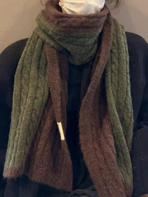 Textured two-tone wool blend scarf in brown and green with cable knit detail.