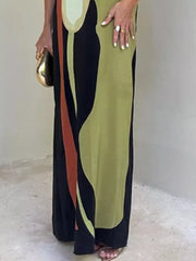 Strapless maxi dress with abstract print in black, green, and rust.