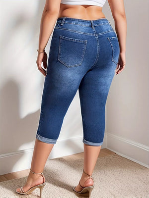 Dark blue denim capri jeans with cuffed hems and a high waist.