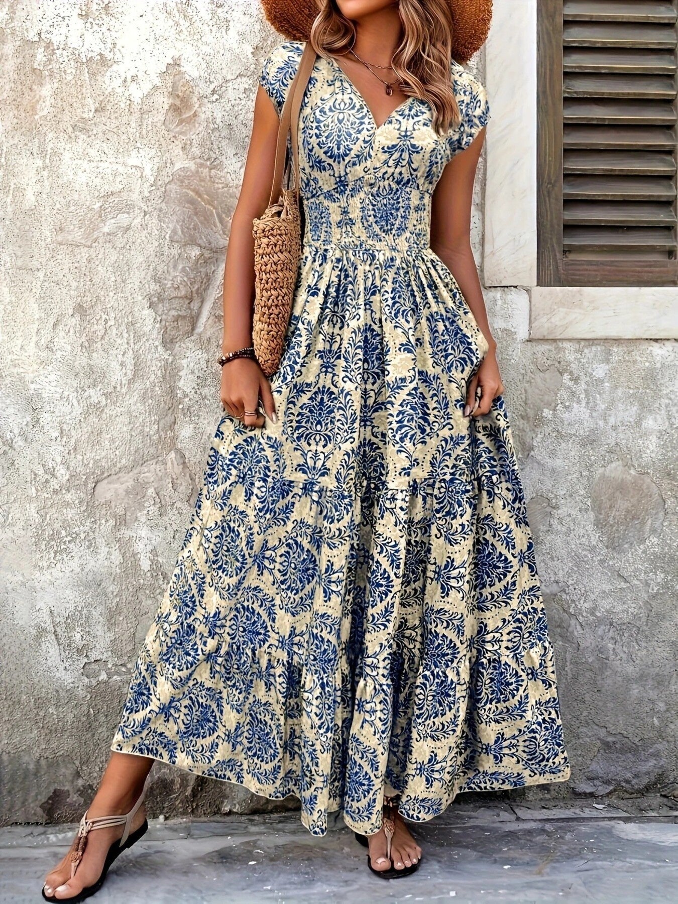 Blue flower damask print cap sleeve maxi dress with smocked waist and tiered skirt.