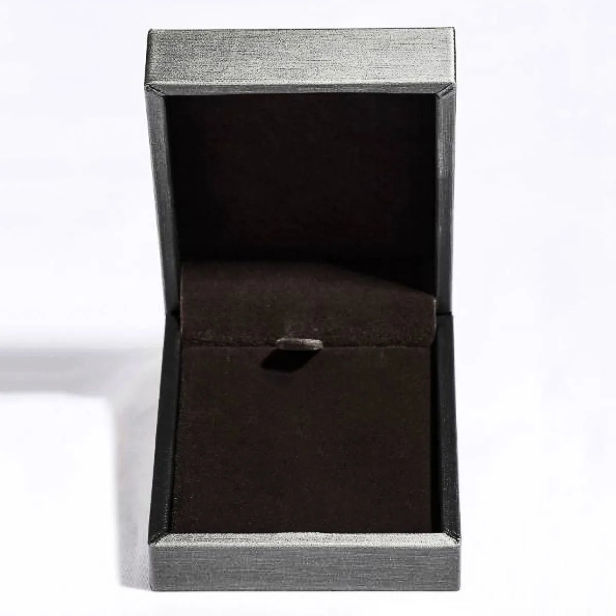 Open jewelry box with textured silver exterior and dark brown interior.