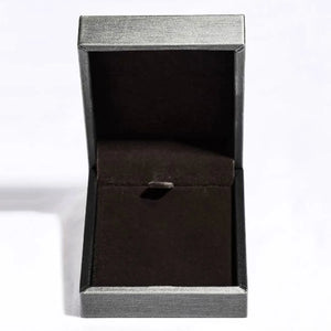 Open jewelry box with textured silver exterior and dark brown interior.
