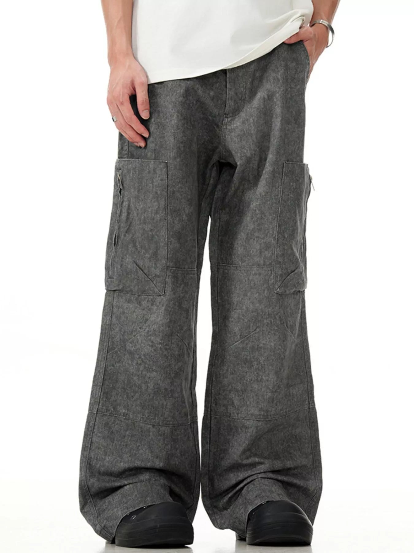 Grey wide-leg cargo pants with multiple pockets and a relaxed fit.