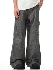 Grey wide-leg cargo pants with multiple pockets and a relaxed fit.