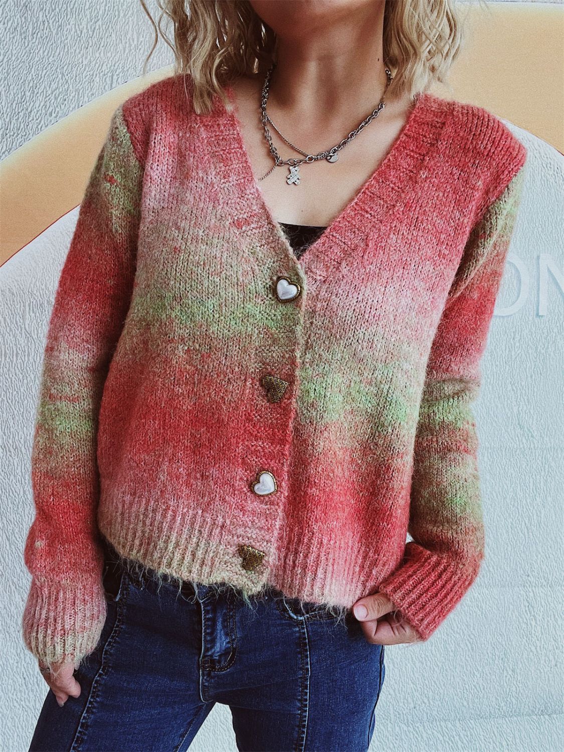 Ombre knit cardigan with heart buttons and a V-neck.