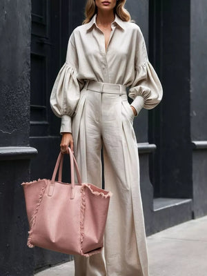 Khaki lantern sleeve button-up shirt and wide-leg pants set with pleated details.
