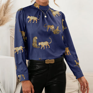 Royal blue leopard print blouse with keyhole neck and long sleeves.