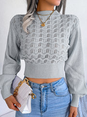 Light gray openwork puff sleeve knit sweater with mock neck and cropped hem.