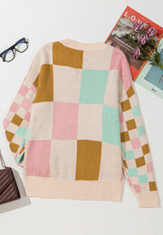 Colorblock checkerboard knit sweater in blush pink, beige, and mint green acrylic.