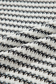 Sleeveless knit tank top in black and white stripes, acrylic fabric.