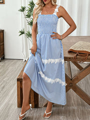 Blue striped midi dress with smocked bodice and lace trim detail.