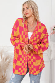 Checkerboard knit open cardigan in orange and pink acrylic with a relaxed fit.