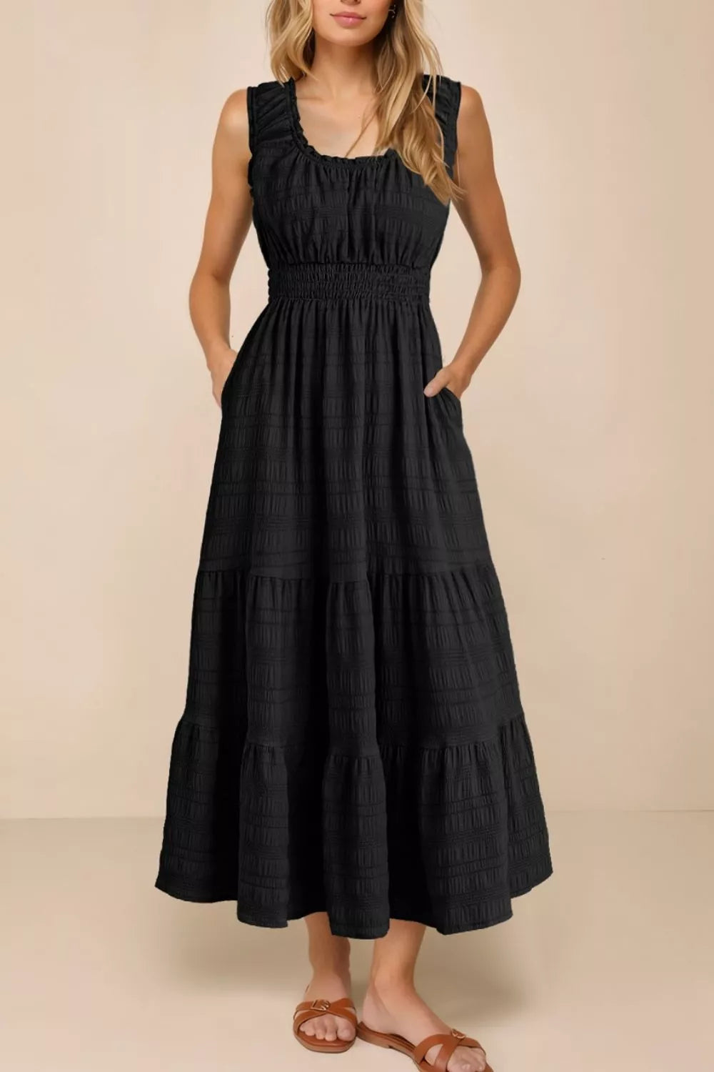 Black smocked tiered midi dress with pockets and square neckline.