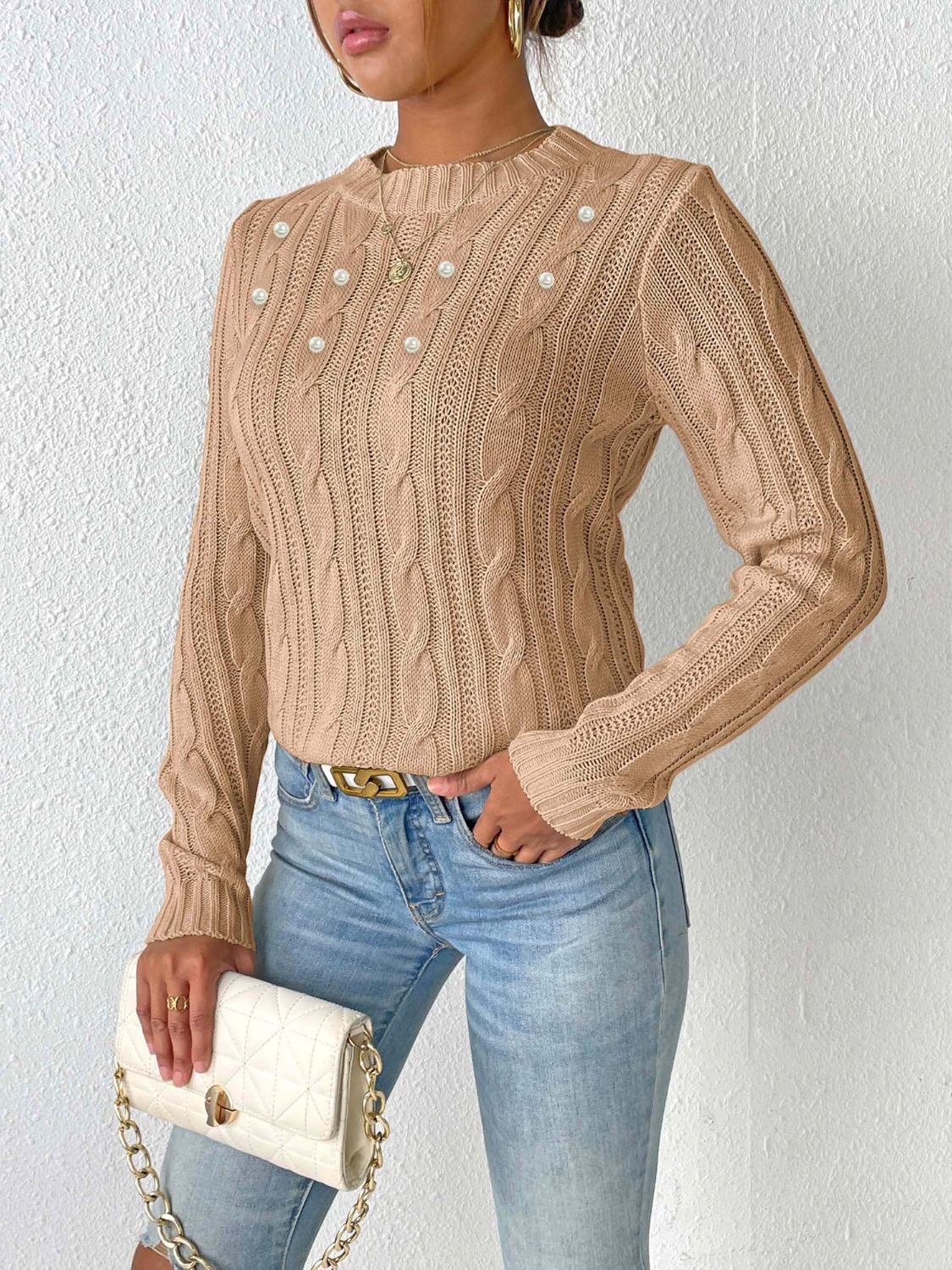 Camel cable knit sweater with pearl embellishments and crew neck.