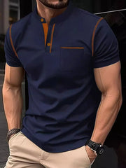 Navy polo shirt with contrast orange stitching, mandarin collar, and chest pocket.