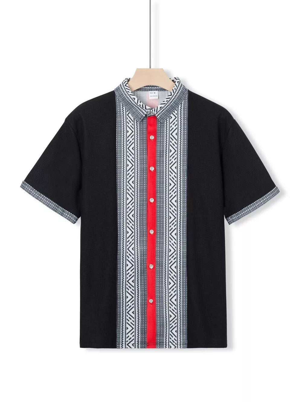 Black short sleeve men's shirt with bold geometric print and red stripe detail.