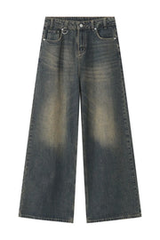 Faded wash palazzo denim trousers in dark blue with a wide leg and distressed details.