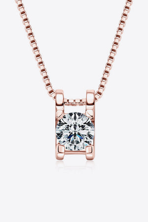 Rose gold necklace with a cubic zirconia pendant in a rectangular setting.