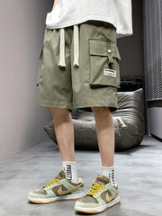 Men's green lightweight cargo shorts with drawstring and multiple pockets.