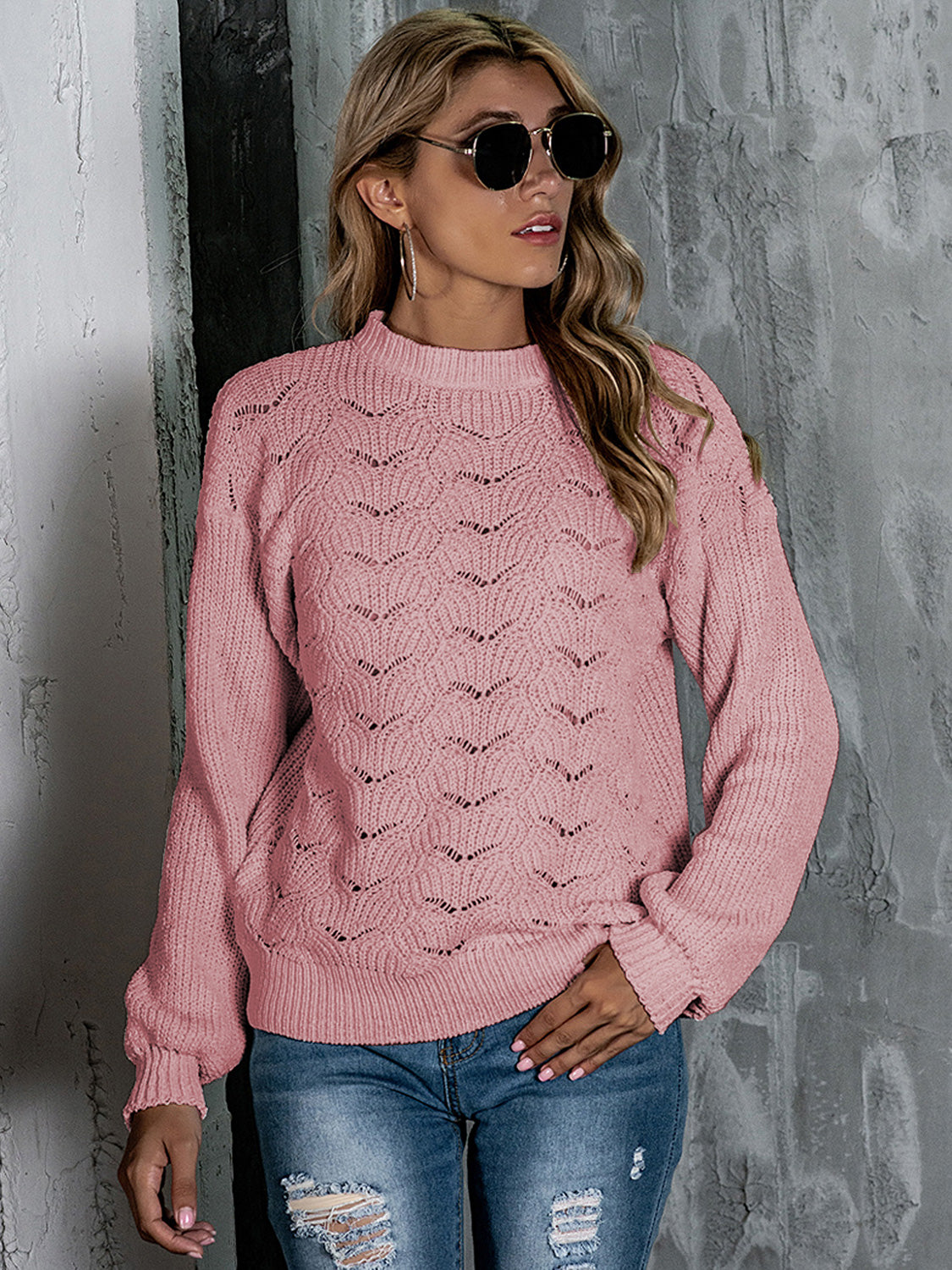 Blush pink openwork knit crew neck pullover sweater with balloon sleeves.