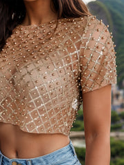Beaded mesh crop top in khaki with short sleeves and a diamond pattern.
