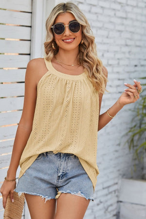 Yellow eyelet halter tank top with a gathered neckline and casual boho style.