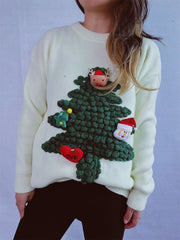 White knit sweater with a 3D Christmas tree applique featuring Santa, an elf, and a heart with love.