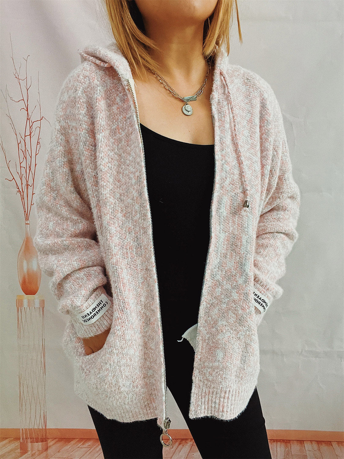 Speckled knit relaxed zip-up hoodie in Blush Pink with a silver zipper and drawstring hood.