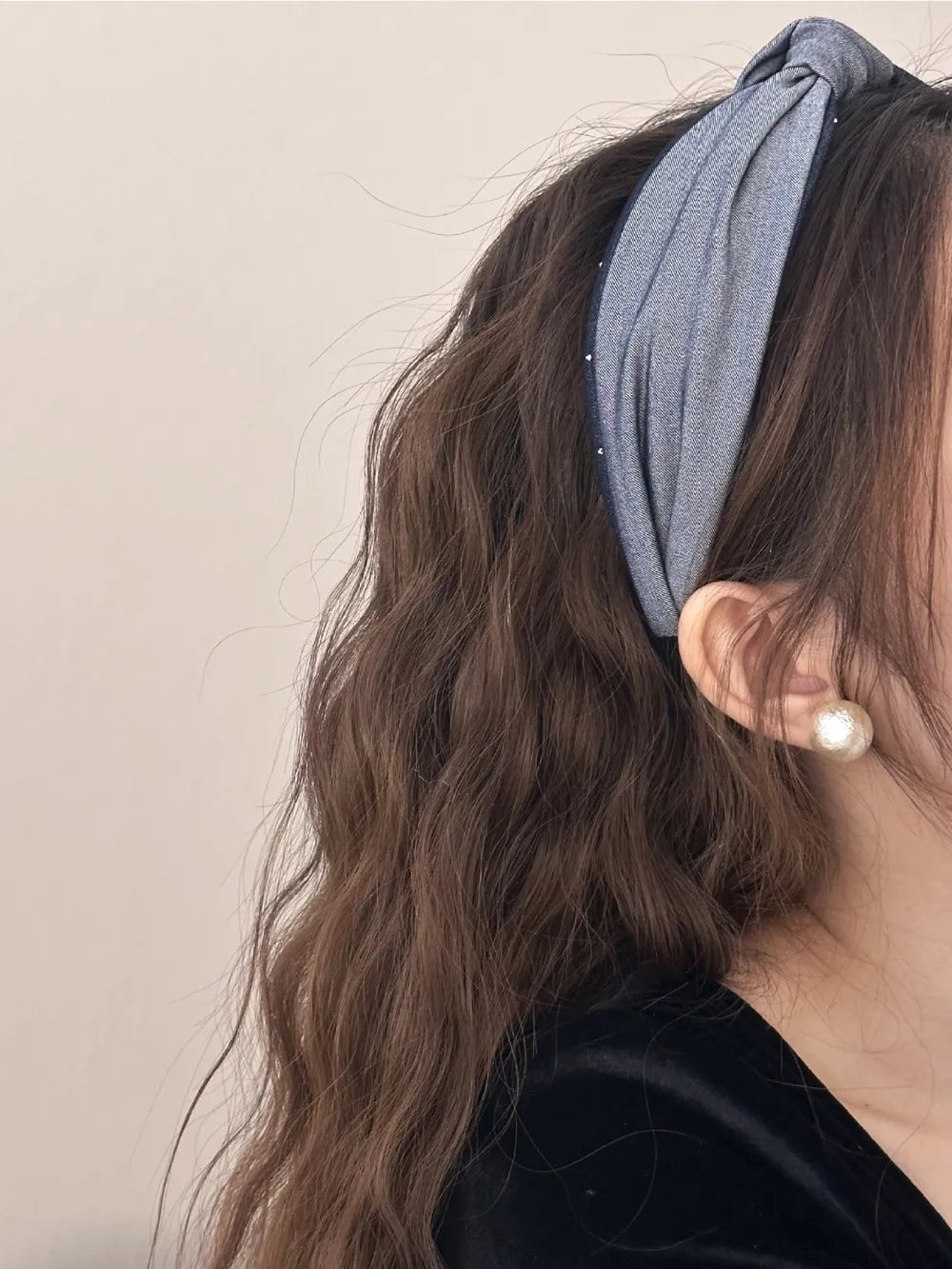 Denim knot headband in medium gray with crystal detail and a twisted knot.
