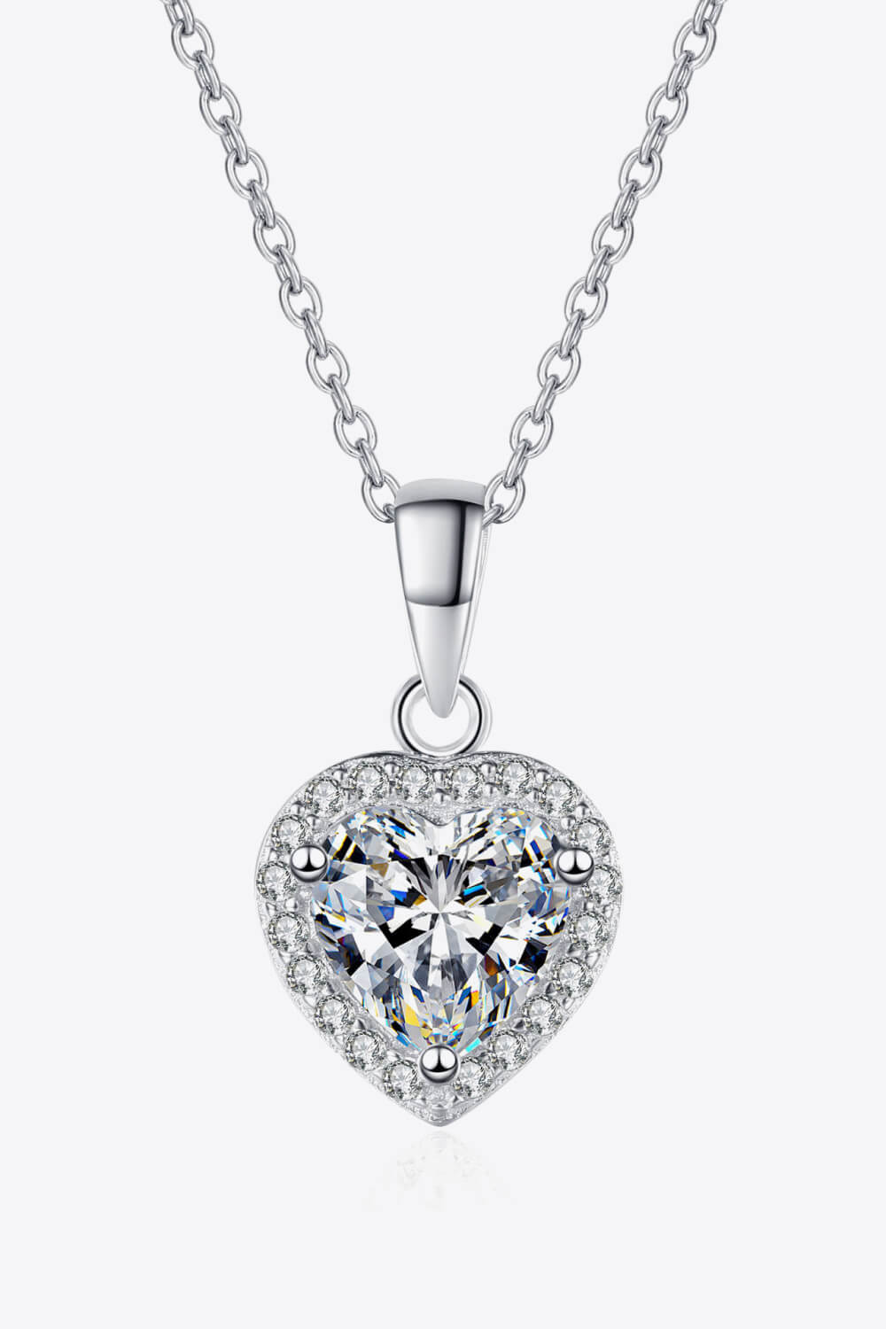 Silver heart cut halo pendant necklace with clear cubic zirconia on a sterling silver chain.