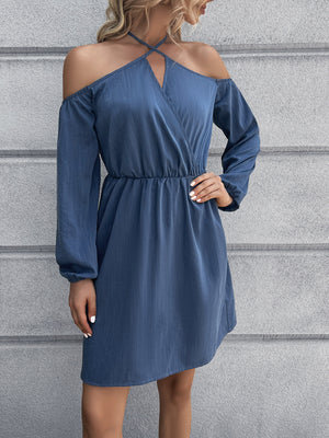 Dusty blue off-shoulder mini dress with cross-strap neckline and long sleeves.