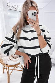 Black and white striped loungewear set with crew neck sweatshirt and drawstring pants.