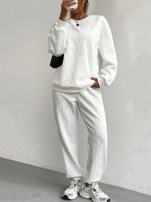 White cable knit loungewear set with crew neck sweatshirt and jogger pants.