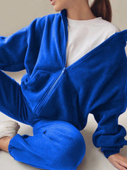 Royal blue fleece hoodie with zipper and pockets, paired with matching joggers.