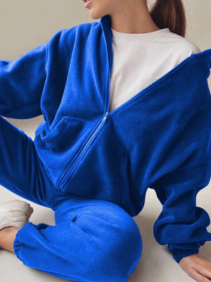 Royal blue fleece hoodie with zipper and pockets, paired with matching joggers.