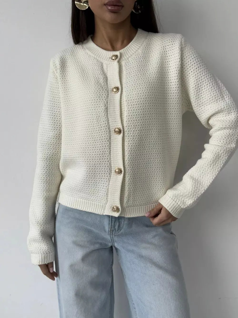White textured knit cardigan with gold button detail and crew neck.