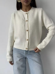 White textured knit cardigan with gold button detail and crew neck.