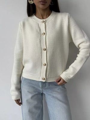 White textured knit cardigan with gold button detail and crew neck.