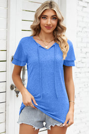 Blue flutter sleeve henley tee with tie neckline and layered sleeves.