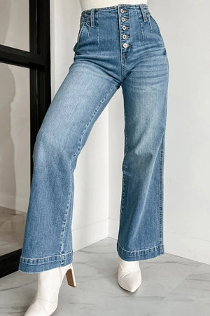 Medium wash denim wide-leg trousers with button fly and high waist.