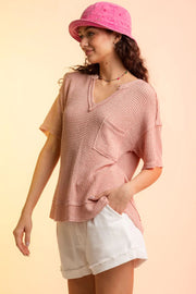 Relaxed waffle knit top in Pale Blush with V-neck and chest pocket.