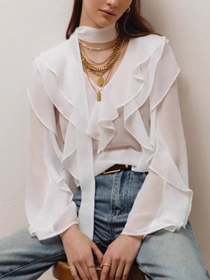 White chiffon blouse with V-neck, ruffle trim, and tie detail.