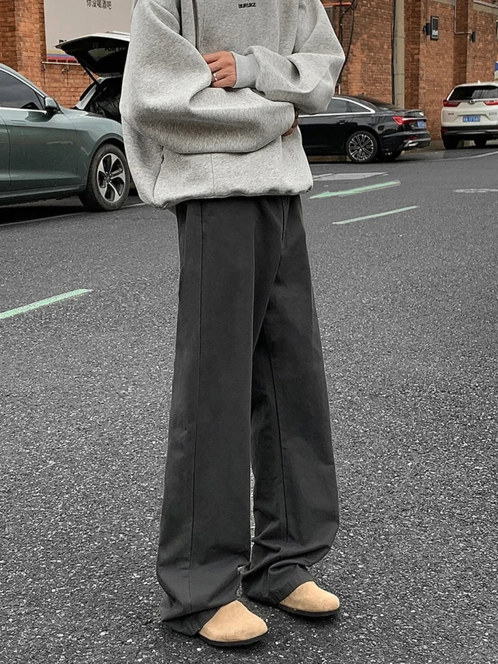 Men's dark gray wide-leg casual jeans with a relaxed fit and clean stitching.