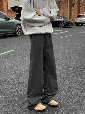 Men's dark gray wide-leg casual jeans with a relaxed fit and clean stitching.